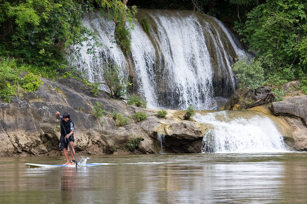 Sailing down the river Kwai on a SUP